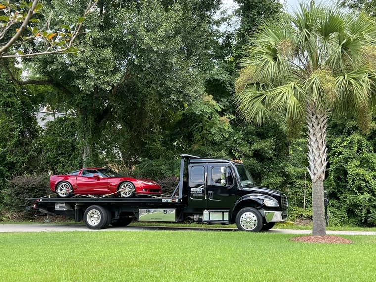 Classic car hauled on a flatbed