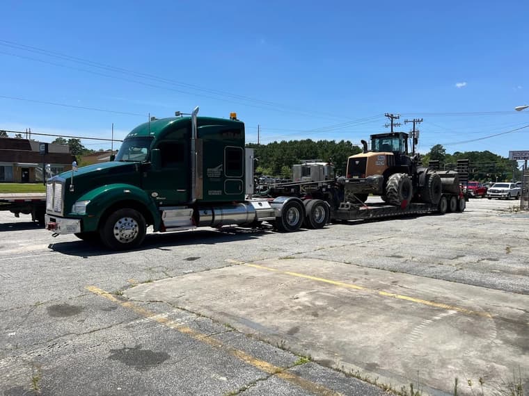 Heavy equipment on Mitchell's lowboy trailer