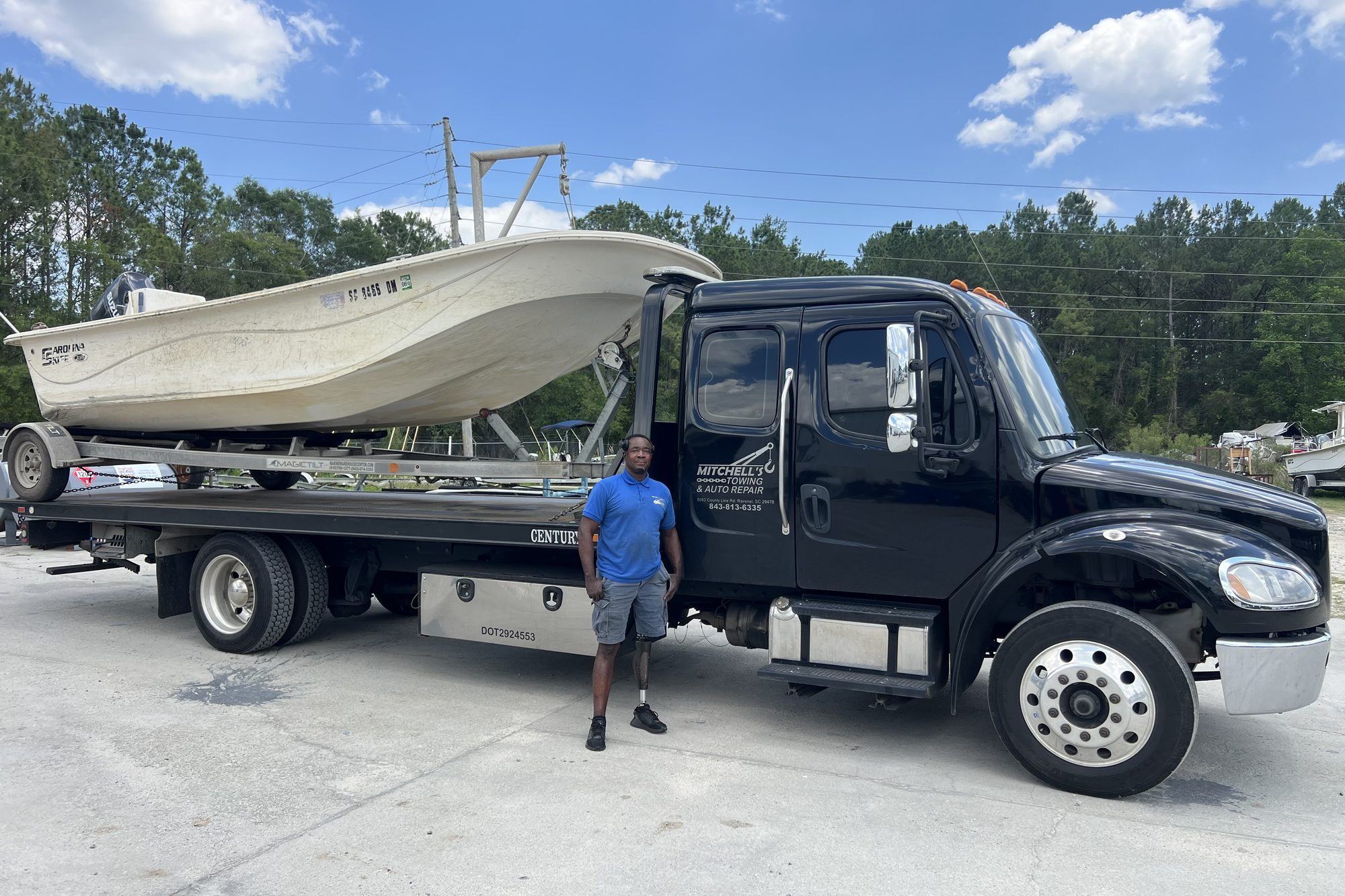 Boat loaded on Mitchell's rollback