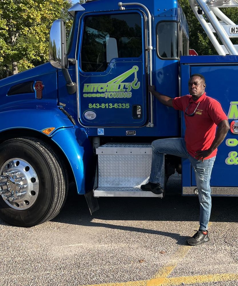 Owner Trevor Mitchell beside the Mitchell's heavy wrecker in Ravenel, SC